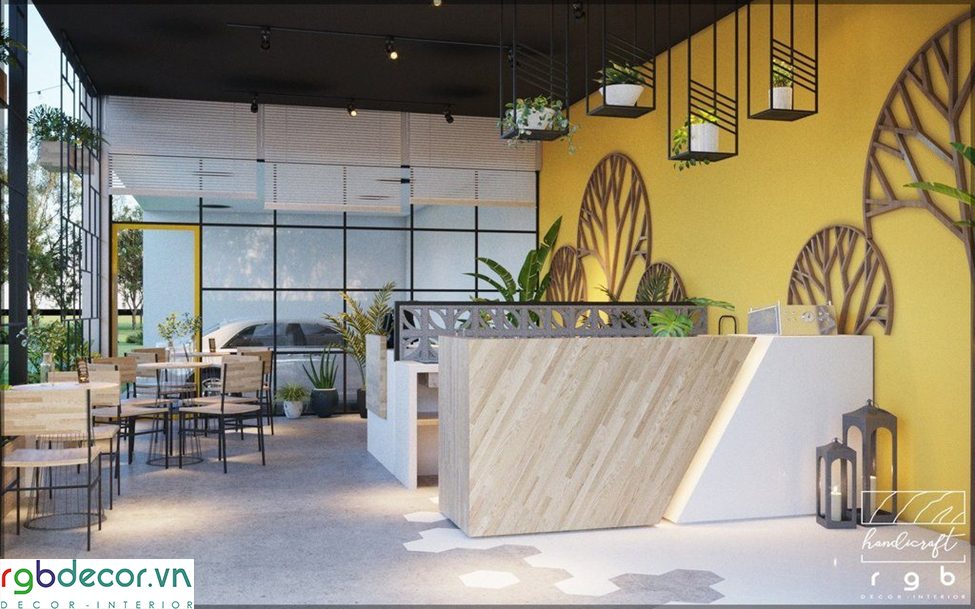 mẫu thiết kế quán cafe tân phú - góc ngồi trong nhà nhìn ra sân